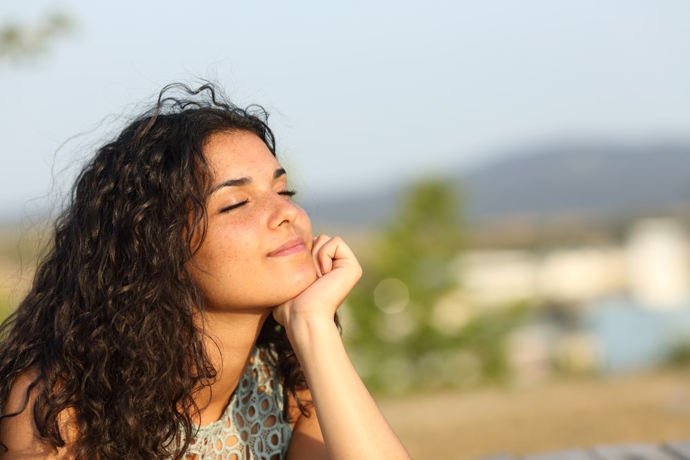 Teenage girl soaks up the San Diego sun a few months after having a nose job.