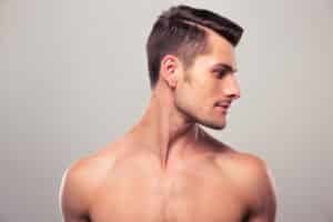 Handsome man in profile shows off a strong jawline and proportional nose.